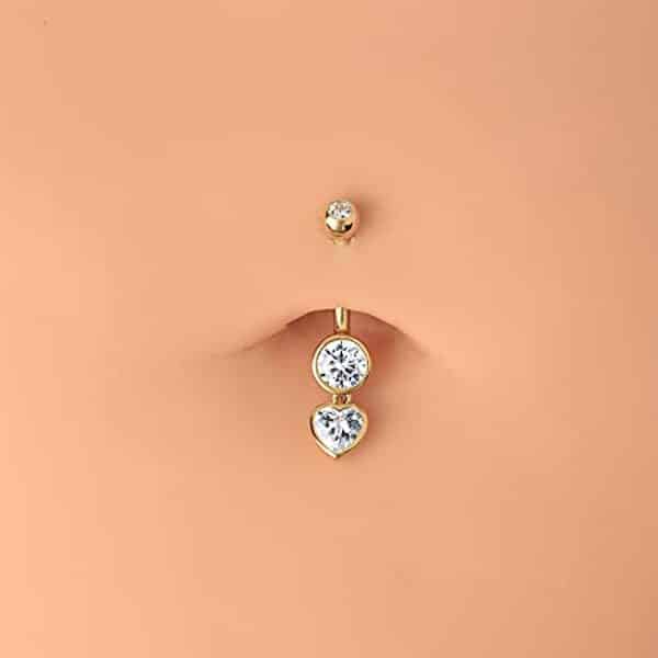 Découvrez notre analyse complète du piercing nombril cœur OUFER : un bijou en or 9 carats orné de zircon cubique pour sublimer votre style.