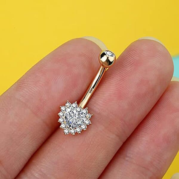 Découvrez notre avis complet sur l'anneau nombril Melighting en or 14 carats avec pendentif cœur CZ : qualité, design et prix. 